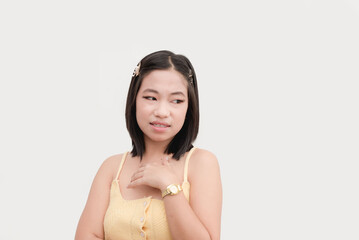 A young pretentious asian woman showing disgust or contempt. Isolated on a white background.