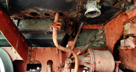 rusty steam punk black machinery with textured components of an old steam train - broken mechanism...