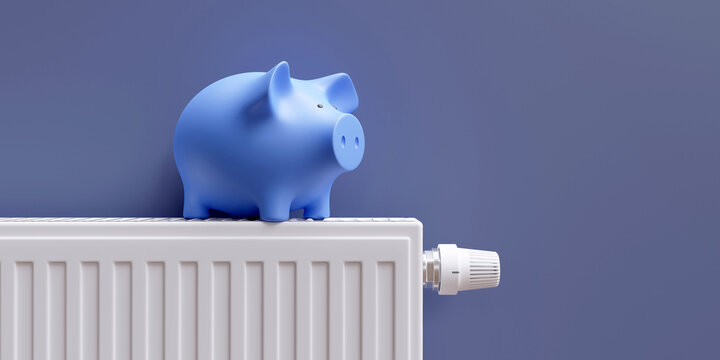 Saving on energy cost in winter. Piggy bank on heating radiator, blue wall background.