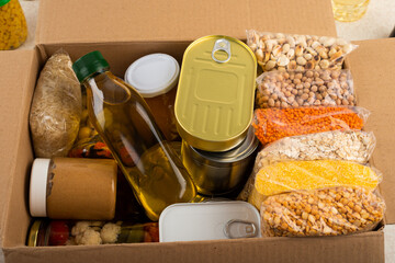 Fototapeta na wymiar Survival set of nonperishable foods in carton box