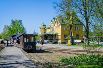 A passenger car is waiting at Mariefred station