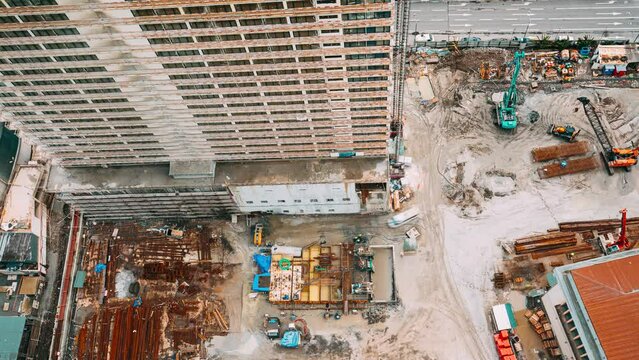 excavator and other machinery with Workers are engaged in repairing development on construction site. timelapse time lapse flat view Construction And Development Of Modern Multi-storey Residential