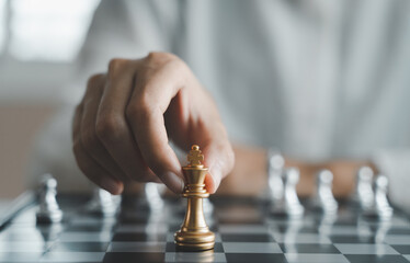 Professional businesswoman think planning challenging strategy to lead success and management leadership competition to victory. Woman playing chess game on desk. Business corporate growth target