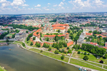Fototapeta premium Wawel Castle in Krakow on a cloudy summer day. Old town in the background.