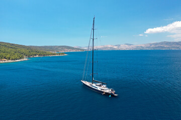 Fototapeta na wymiar Beautiful yacht moored near the Croatian town of Trogir during summertime.