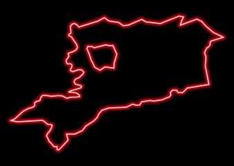 Red glowing neon map of Vas Hungary on black background.