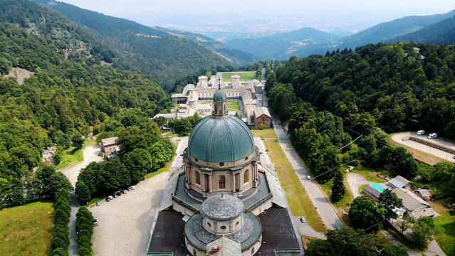 OROPA, BIELLA, ITALY - JULY 7, 2018: aero View of beautiful Shrine of Oropa, Facade with dome of the Oropa sanctuary located in mountains near the city of Biella, Piedmont, Italy. High quality photo