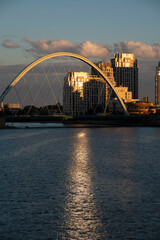 Nursultan, Kazakhstan, August 2022. View of the bridge on the embankment of the Yesil River at sunset. High quality photo