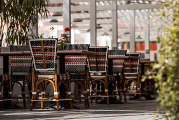 Table and chairs. Summer verandas. Street fast food. A fast food restaurant in the fresh air. Interior. Stylish furniture. Blurred background.