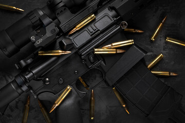 AR15 rifle with cartridges, flat lay composition