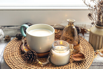 Cozy home composition with a cup of coffee and decor, close-up.