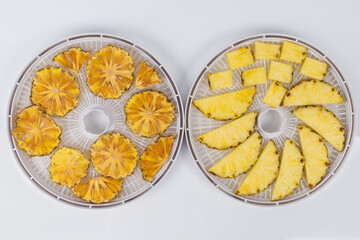close-up, in two round grids, dried pineapple and fresh