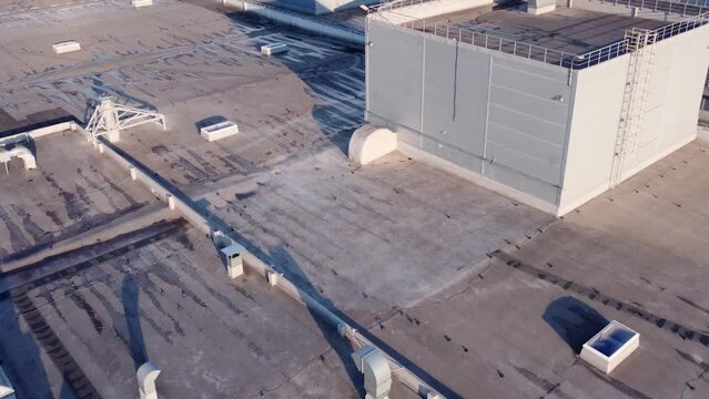 Aerial view of roof equipment and windows after rain.