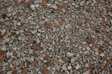 abstract background: gravel and pieces of broken tiles