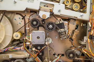 background of the drive gear and mechanisms of the metal dispenser ATM