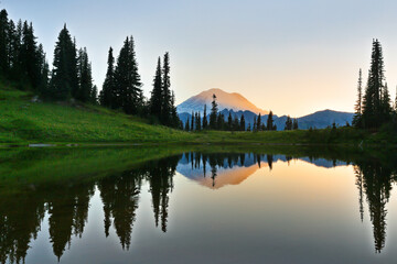 Beautiful sunset over MT Rainier with reflection viewing from Tipsoo lake, MT Rainier National Park, Washington.