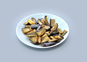 dish with baked eggplant on grey background