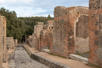 Ruins of the ancient city of Pompeii, ancient Roman city covered by the eruption of the volcano Vesuvius, Italy. Street in Pompeii
