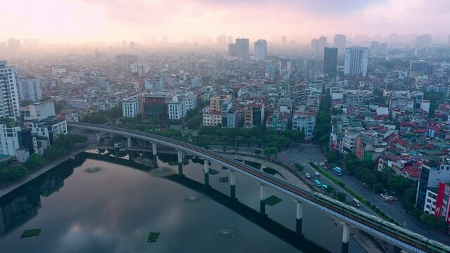 Drone view, aerial view of Vietnam Hanoi city in the morning with the train Metropolis running.and beautiful sky