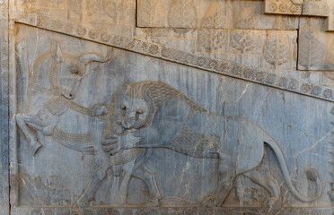 Bas-relief decoration along stairs from Darius palace to Palace of Xerxes. Ancient ruins of Persepolis near Shiraz in southern Iran. This UNESCO World Heritage Site showcases beautiful ruins from the 
