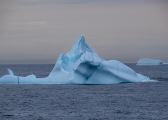 Navigating among gigantic icebergs along the Western coast of Greenland during the midnight sun