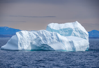 Navigating among gigantic icebergs along the Western coast of Greenland north of Paamiut