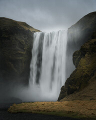 Atmospheric view of iconic Skogafoss waterfall on Skoga river. Southern Iceland, Europe. 