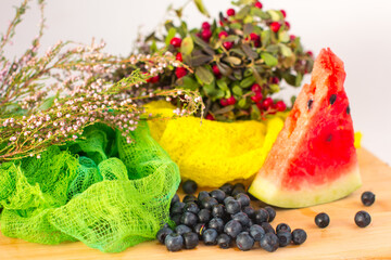 slices of red watermelon and cranberries. Ripe harvest