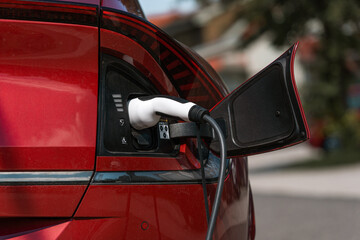 EV charging station for electric car in concept of green energy and eco power produced from sustainable source to supply to charger station in order to reduce CO2 emission.