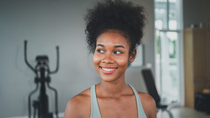 Women do weight training with male coaches.Exercise for different musclesA beautiful smiling woman is satisfied with her body.indoor sports.,