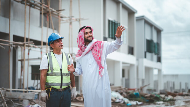 Arab Muslims are engaged in architecture business and are architects.Saudi manager organizes confidence meeting with partners. human achievement architecture construction site.