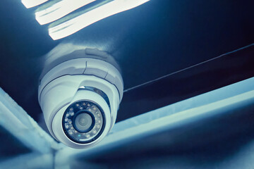 Indoor surveillance security camera in the elevator of a residential building. CCTV camera on an...