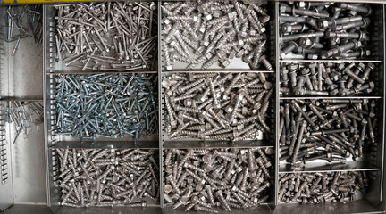 Top view of bolts and nuts that lie in their
boxes.