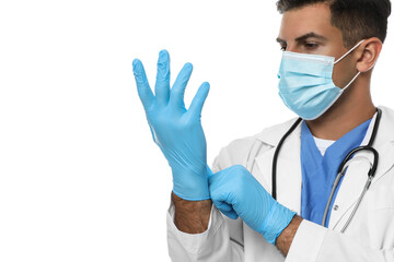 Doctor in protective mask putting on medical gloves against white background