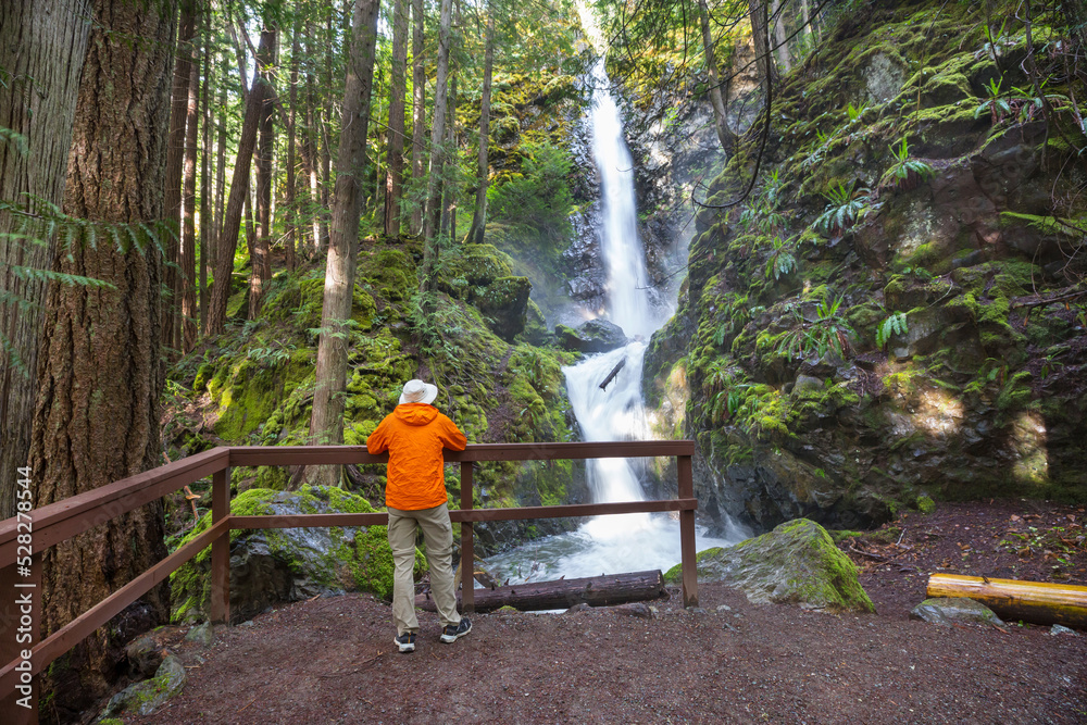 Sticker hiker near waterfall