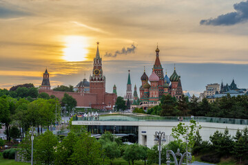 Fototapeta na wymiar MOSCOW, RUSSIA - JUNE 2022: Moscow. View of Red Square with the Moscow Kremlin and St. Basil's Cathedral from park Zaryadye (Zaryadye inscription)