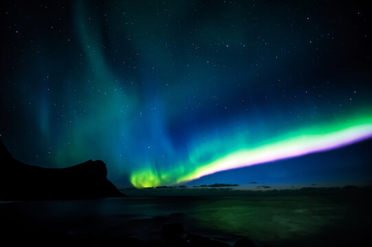 Northern lights over arctic landscape, Lofoten, Nordland, Norway