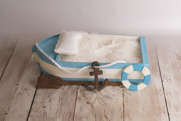 blue wooden boat newborn prop - obrazy, fototapety, plakaty