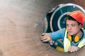 Smart confidence professional industrial engineer,operator worker with hard hat inspect, check roll...