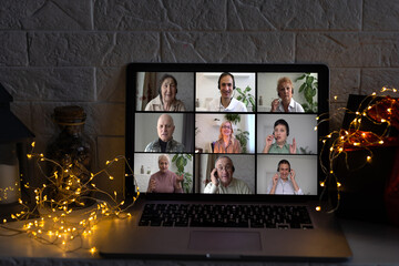 Fototapeta na wymiar Remote Christmas video party. Family call celebrate New Year 2023 Online video conferencing. Virtual meeting conference calling from home
