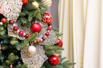 Christmas balls decorate a Christmas tree.