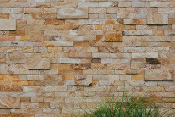 Wall made of beige glossy tiles. Texture, background for design.