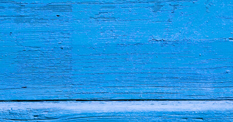 An abstract background of a wooden board in blue.