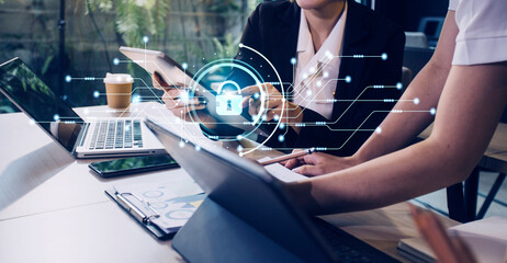 Cybersecurity and privacy concepts to protect data. Lock icon and internet network security technology. Businessman protecting personal data on smart phone with virtual screen interfaces.