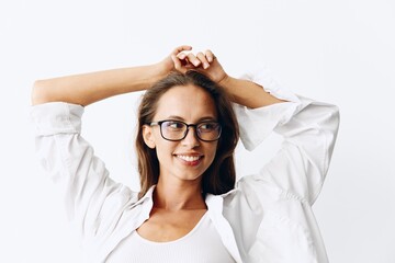 Woman portrait with tanned skin wearing eyeglasses on white background smiling