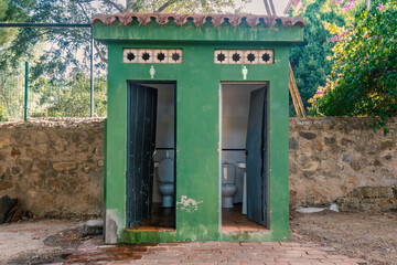 Old, open, public toilet in a park