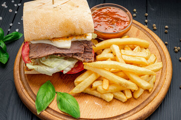 Smoked beef panini sandwich, served with salad and french fries