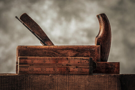 craftsmanship concept illustrated by carpentry tools planer and ruler