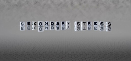 secondary stress word or concept represented by black and white letter cubes on a grey horizon...
