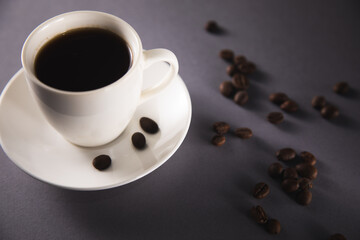 cup of coffee with coffee grain